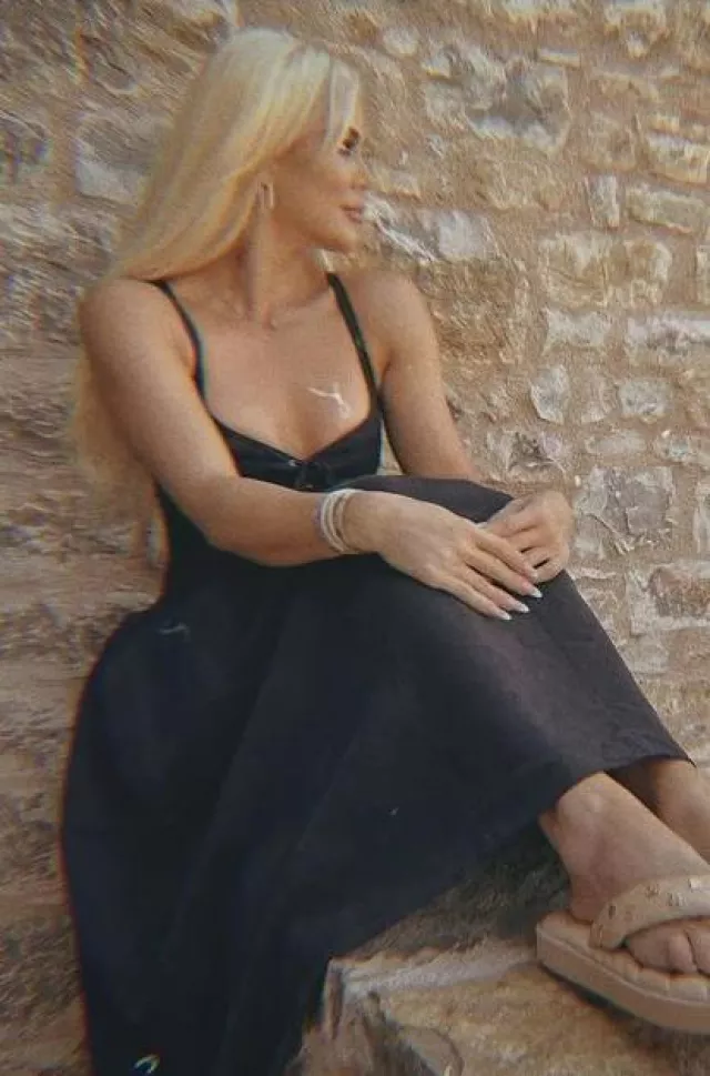 Chloe Sleeveless Midi Dress worn by Khloe Kardashian on her Instagram Post on August 18, 2023
