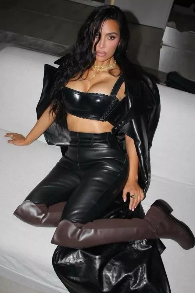 Saint Laurent Belted Leather Trench Coat worn by Kim Kardashian on her Instagram post on September 22, 2023