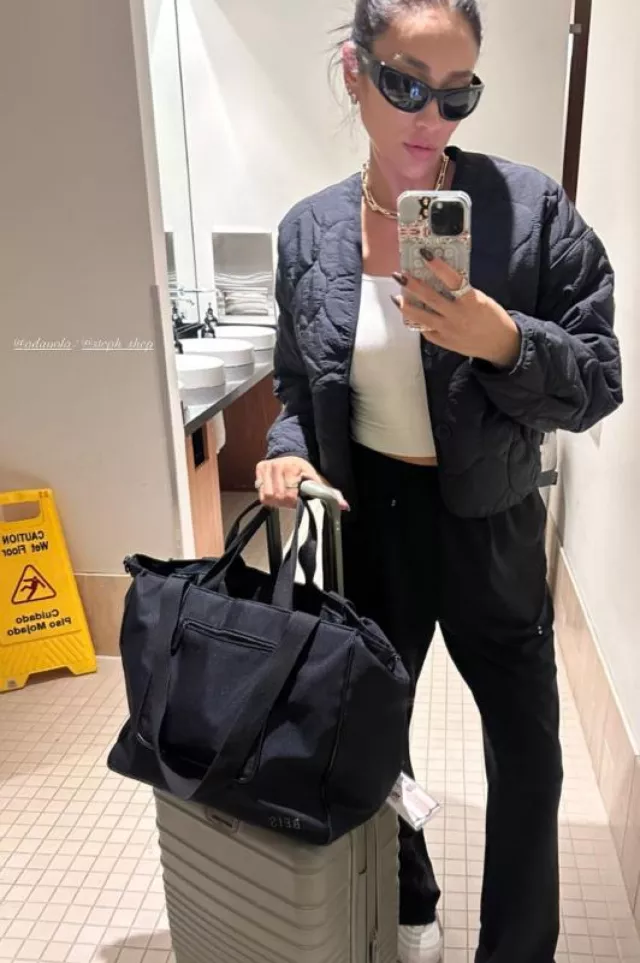 Beis The Carry On Roller in Grey worn by Shay Mitchell on her Instagram Story on September 28, 2023