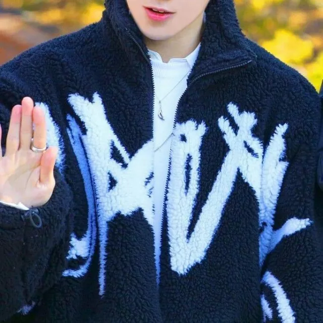 The black fur jacket "I AM NOT A HUMANBEING" worn by Yeosang on @of_kpop's Instagram account
