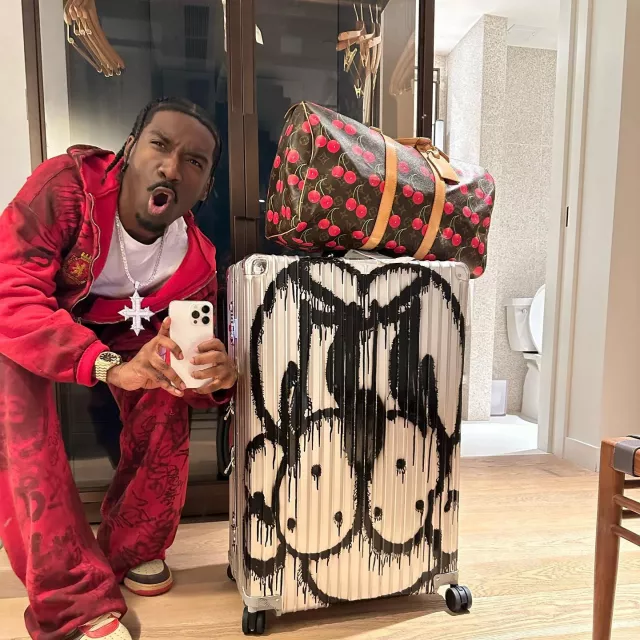Tracksuit in red worn by BruceDropEmOff on the Instagram account of @raycondones