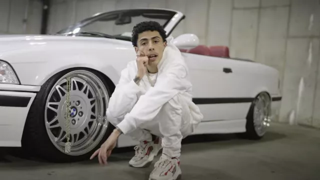 Amiri Red & White Bone Runner Sneakers worn by J.I. in Please Don't Go (Official Music Video)
