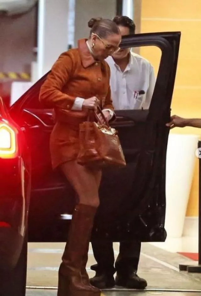 Hermes Shiny Crocodile Birkin Bag In Miel worn by  Jennifer Lopez in Los Angeles on October 4, 2023