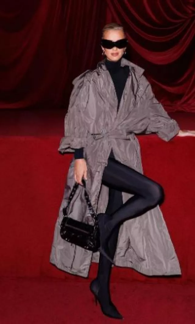Balenciaga Belted Crinkled-Taffeta Trench Coat worn by Nicky Hilton Rothschild at Balenciaga Show on October 1, 2023