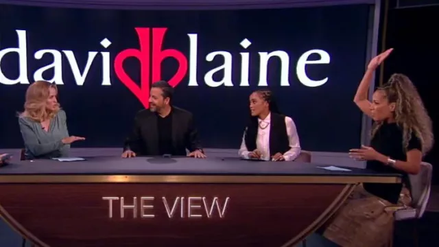 A.W.A.K.E Mode Weaved Vegan Leather Skirt worn by Sunny Hostin as seen in The View on  October 12, 2023