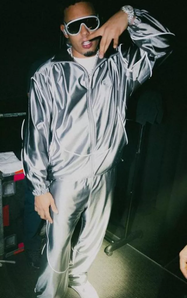 Alexander Wang Shiny Sil­ver Satin Track­pants worn by Myke Towers on the Instagram account @myketowers