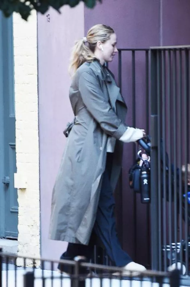 Adidas Gazelle Beige and Cloud White Sneakers worn by Jennifer Lawrence in New York City on October 16, 2023