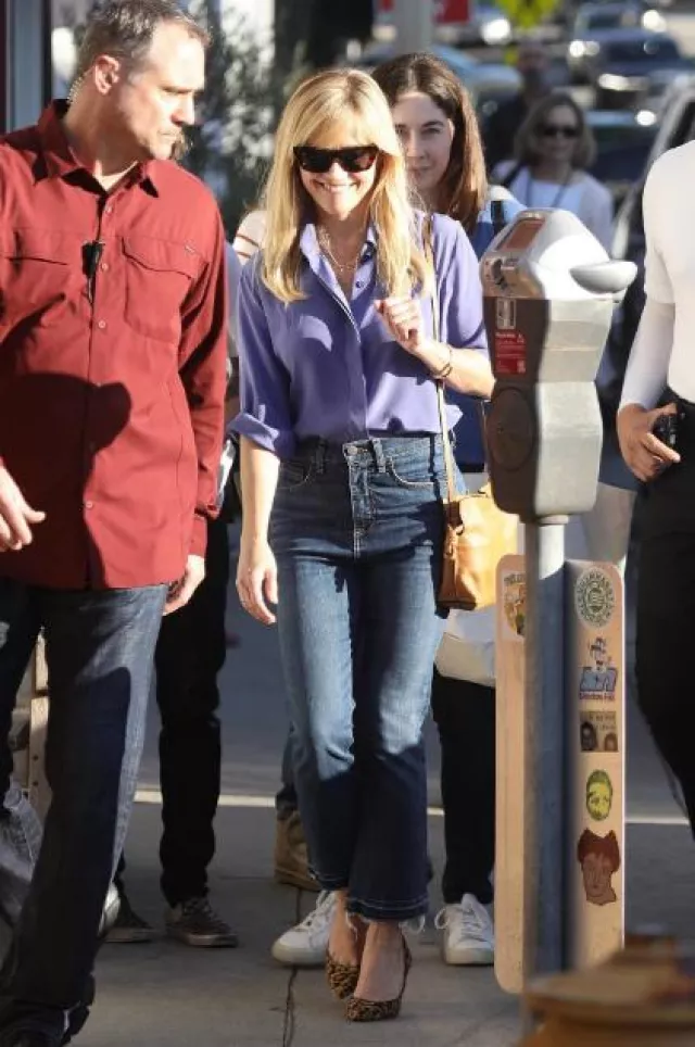 Draper James Crop Flare Denim In Medium Wash worn by Reese Witherspoon in Attending a Book Event at the Brentwood Country Mart on October 22, 2023