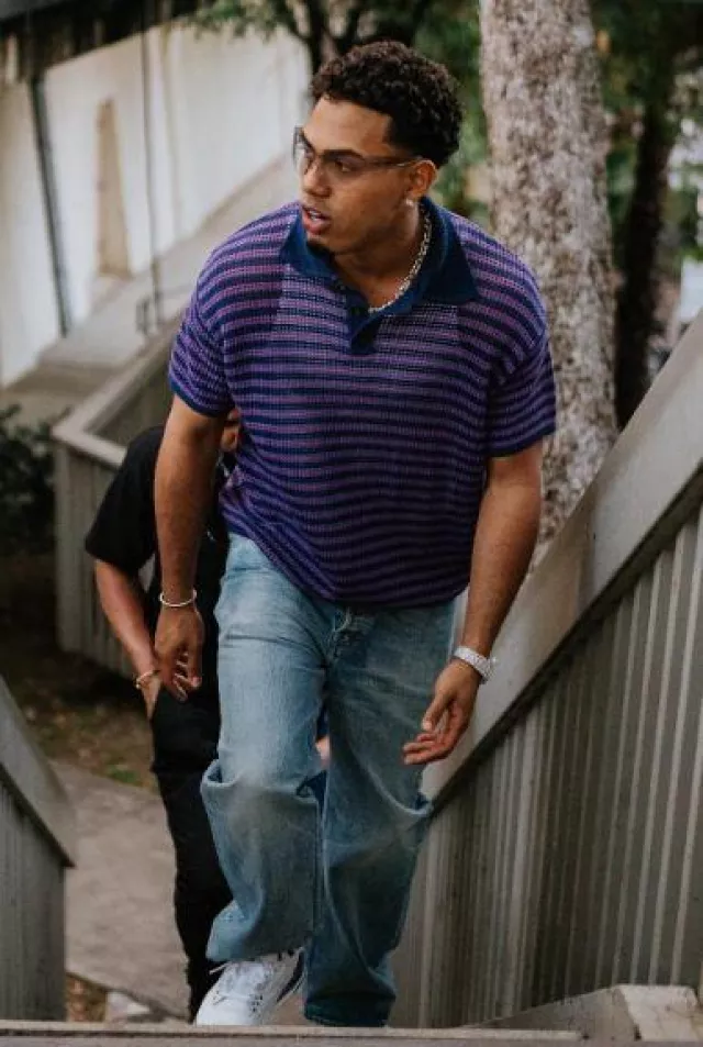 Bode Purple & Navy Striped Crochet Polo worn by Myke Towers on the Instagram account @myketowers