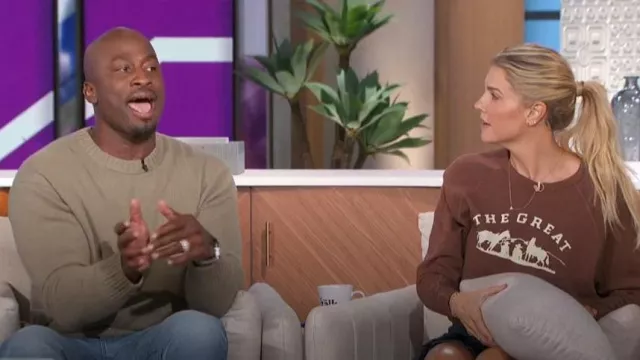 Frame Cashmere Crewneck Sweater in Khaki Green worn by Akbar Gbaja-Biamila as seen in The Talk on November 7, 2023