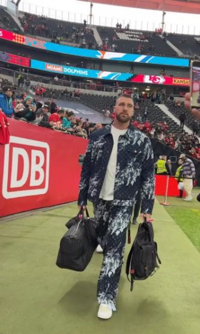 Bottega Veneta Black Leather Intrecciato Duffle Bag worn by Travis Kelce on the Instagram account @killatrav