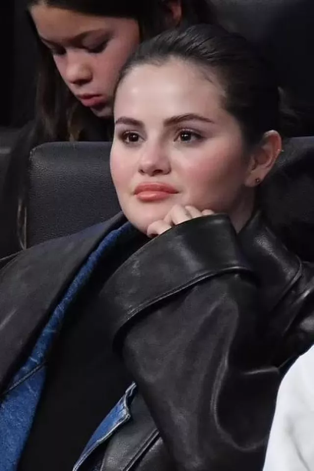 Alexander Wang Shawl Leather Coat worn by Selena Gomez at Lakers Game on October 30, 2023