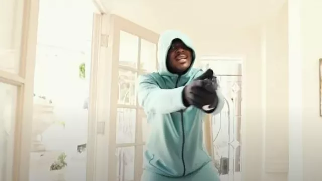 Nike Black Swoosh Running Gloves worn by Remble in "PAINT THE TOWN BLUE FREESTYLE" (OFFICIAL MUSIC VIDEO)