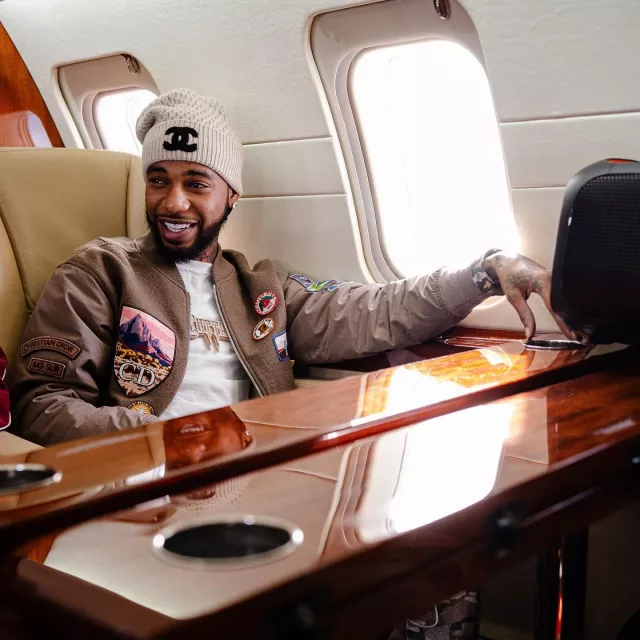 Dior Jack Kerouac Brown Patches Bomber Jacket worn by Key Glock on the Instagram account @keyglock