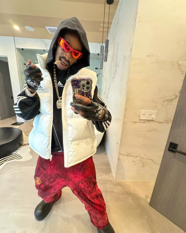 Balenciaga Red Wrap Reverse Xpander Sunglasses worn by Wiz Khalifa on the Instagram account @wizkhalifa