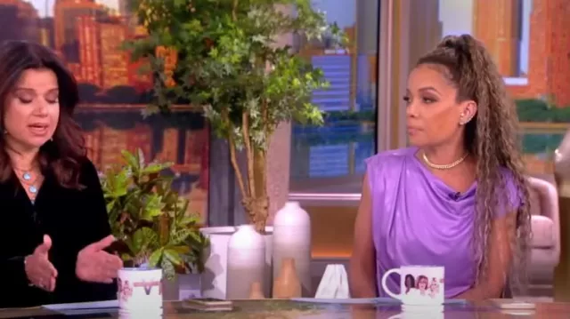 Dries Van Noten Hotan Cowl Neck Cap Sleeve Jersey Top worn by Sunny Hostin as seen in The View on November 21, 2023