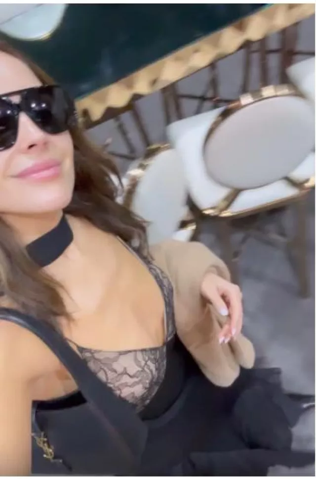 Saint Laurent Le 5 a 7 Hobo Bag in Smooth Leather worn by Olivia Culpo on her Instagram Story on November 18, 2023