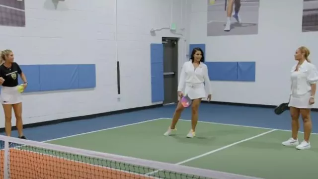 Nike Dri-Fit Uv Vic­to­ry Sol­id Golf Skirt worn by Mia Thornton as seen in The Real Housewives of Potomac (S08E04)