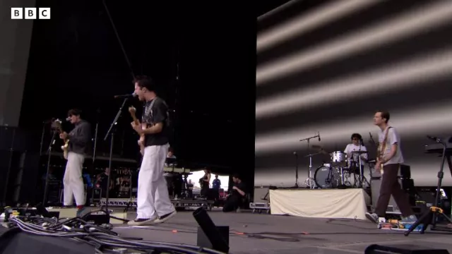 White pants worn by Dylan Minnette for his live performance with Wallows at Reading Festival 2022
