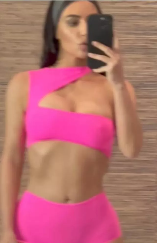 Skims Fits Everybody High-Waisted Thong in Neon Pink worn by Kim Kardashian on the Instagram account @kimkardashian