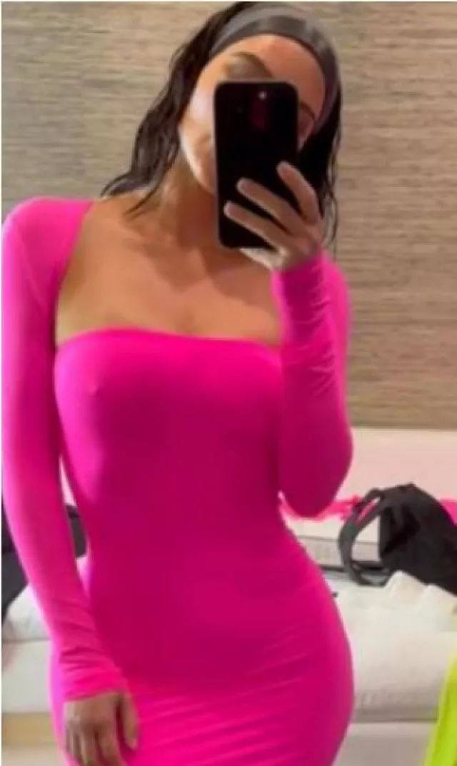 Skims Fits Everybody Tube Dress in Neon Pink worn by Kim Kardashian on her Instagram on Story June 12, 2023