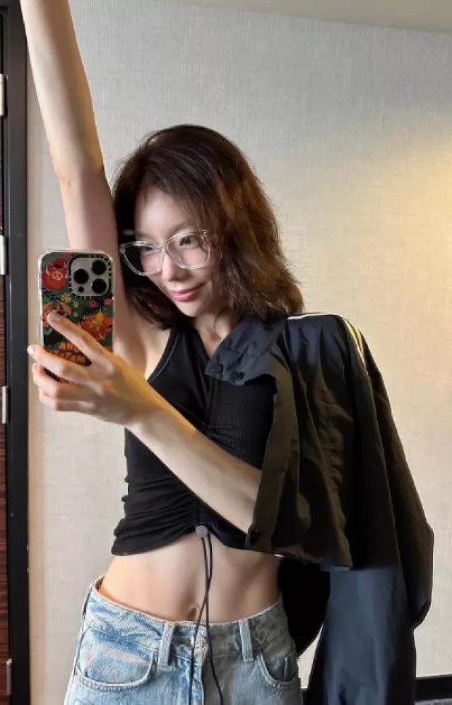 En or Double Stripe String Crop Jacket worn by Taeyeon on her Instagram on June 11, 2023