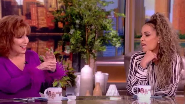 Proenza Schouler Flou Belt­ed Pleat­ed Striped Crepe Mi­di Dress worn by Sunny Hostin as seen in The View on November 29, 2023