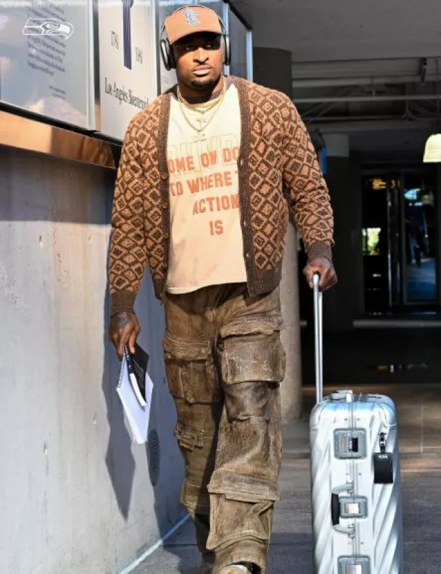 Acne Studios Brown Diamond Faces Cardigan worn by DK Metcalf on the Instagram account @dk14