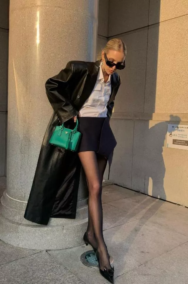 Prada Asymmetric Hem Mini Skirt worn by Leonie Hanne on her Instagram post on December 6, 2023