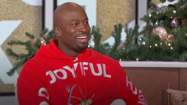 Yema GJH Hoodie in Lali Red worn by Akbar Gbaja-Biamila as seen in The Talk on  December 7, 2023