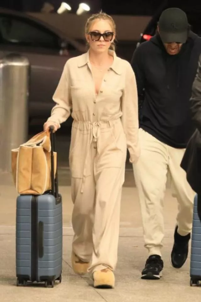 Celine Fur Mule in Shearling worn by Sydney Sweeney at LAX Airport on December 16, 2023