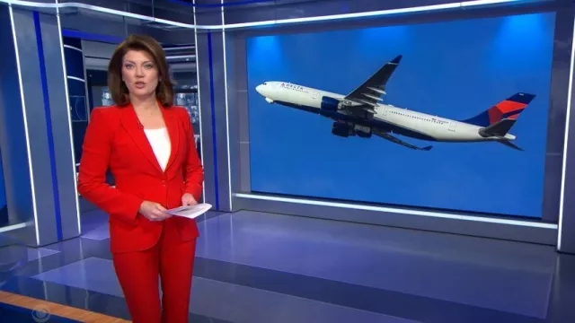 Alexander McQueen Mid-Rise Flared Pants worn by Norah O'Donnell as seen in CBS Evening News on December 12, 2023