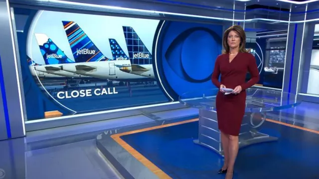 Alexander McQueen Fitted Wrap-Front Dress in Burgundy worn by Norah O'Donnell as seen in CBS Evening News on December 15, 2023