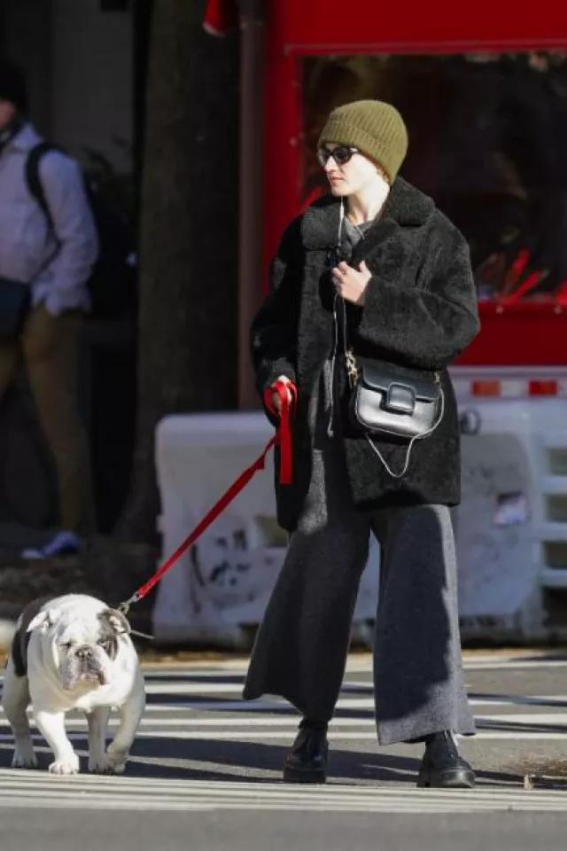 The Row Zipped 1 Leather Ankle Boots worn by Julia Garner in New York City on December 19, 2023