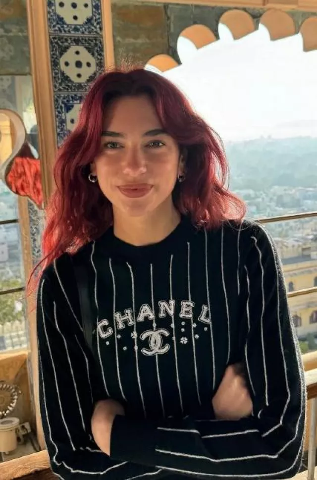 Chanel Spring 23 Stripes Cashmere Pullover worn by Dua Lipa on her Instagram Post on December 24, 2023