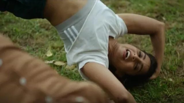 Adidas Sports­wear Cropped Top with Three Stripes worn by Corrie D'Souza (Pallavi Sharda) as seen in The Twelve (S01E03)