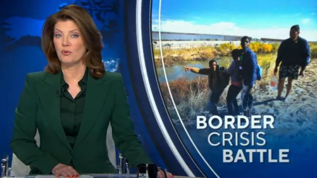 Michael Kors Collection Hansen Charmeuse Shirt in Forest worn by Norah O'Donnell as seen in CBS Evening News on January 4, 2024