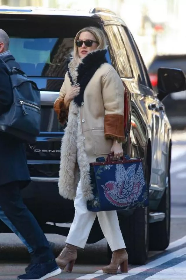 Loveshackfancy Larsa Bow Embellished Wool Cashmere Cardigan worn by Kate Hudson in New York City on January 5, 2024