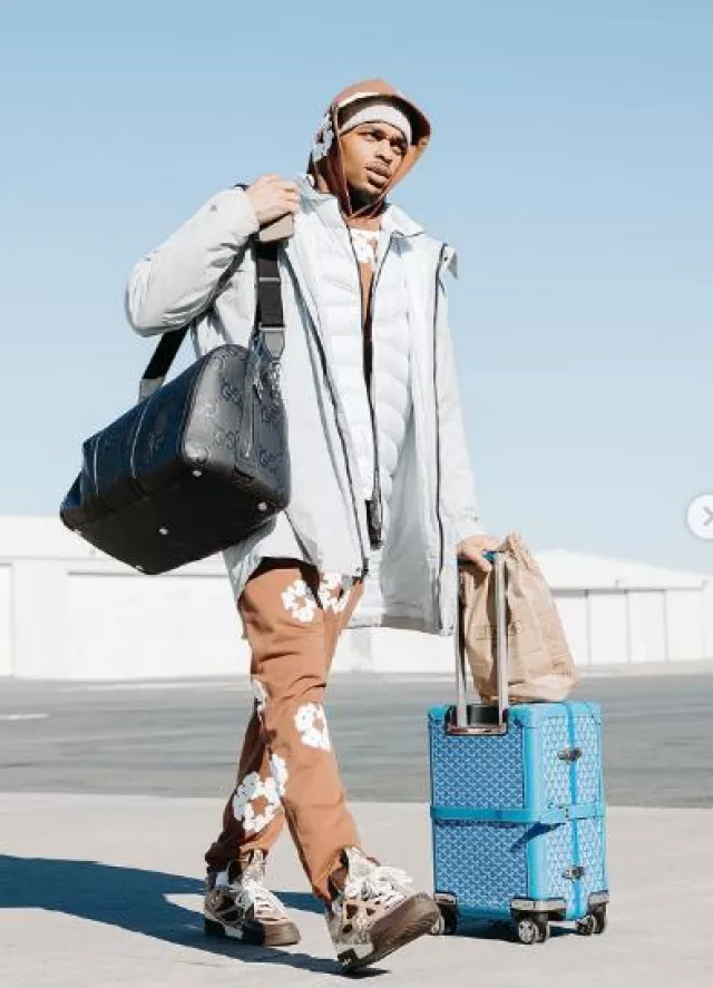 Gucci Black Jumbo-GG Leather Duffle Bag worn by Paul Jamaine Washington Jr. on the Instagram account @pjwashington