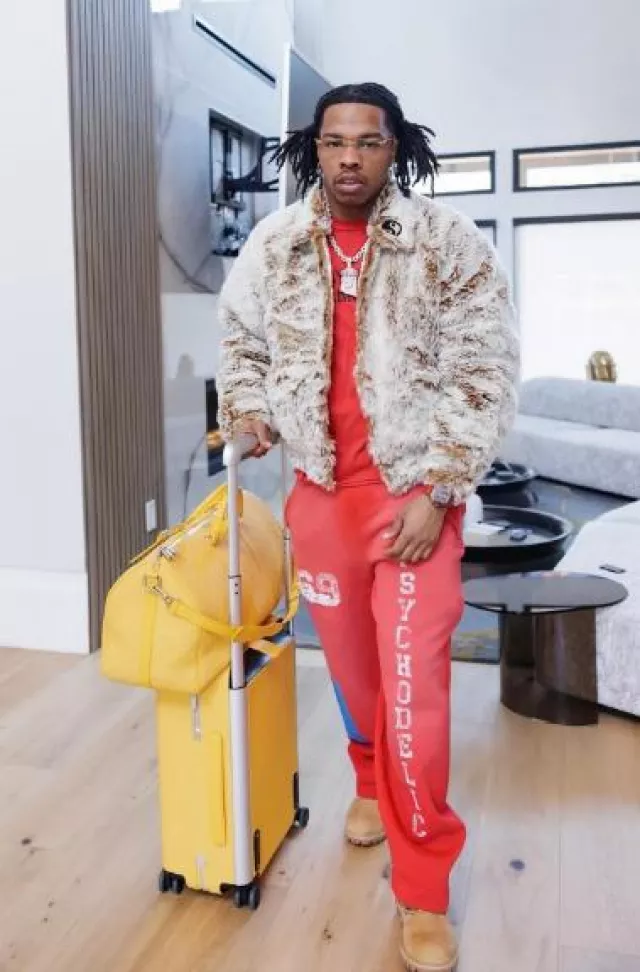 Louis Vuitton Yellow Monogram Leather Horizon 55 Suitcase worn by Lil Baby on the Instagram account @lilbaby