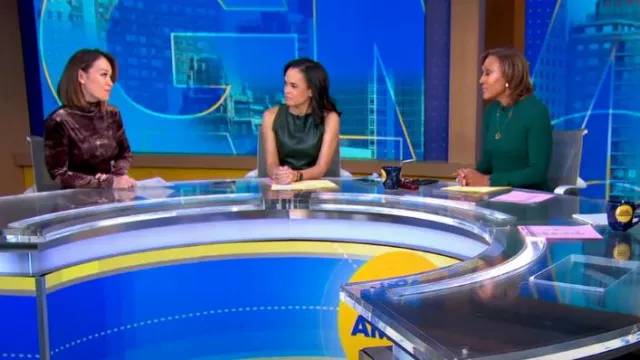 Ann Taylor Faux Leather Mixed Media Sweater Dress In Boxwood Green worn by Linsey Davis as seen in Good Morning America on January 29, 2024