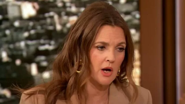 Ben-Amun 24k Gold Electroplated Drop Hoop Earrings worn by Drew Barrymore as seen in The Drew Barrymore Show on January 23, 2024