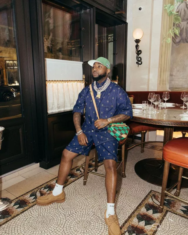 Louis Vuitton Green & Brown Damier 'Chess' Messenger Bag worn by Davido on the Instagram account @davido