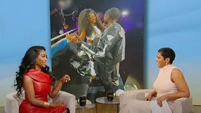 Alexander McQueen One-Shoulder Draped Leather Midi Dress worn by Kenya Moore as seen in Tamron Hall Show on February 6, 2024