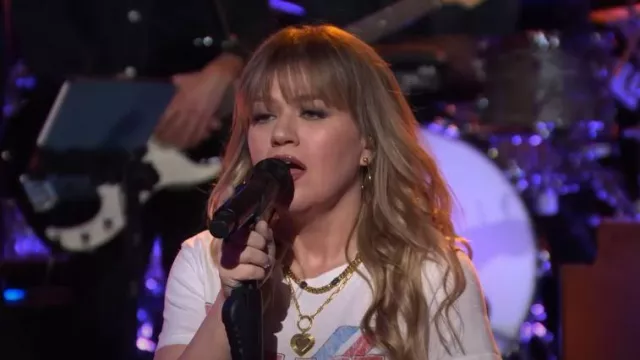 Prince Peter Police Ghost in the Machine Graphic Tee worn by Kelly Clarkson as seen in The Kelly Clarkson Show on February 15, 2024