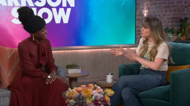 Sergio Hudson Scarf-Neck Pleated Asymmetric Midi Dress worn by Kelly Clarkson as seen in The Kelly Clarkson Show on February 27, 2024