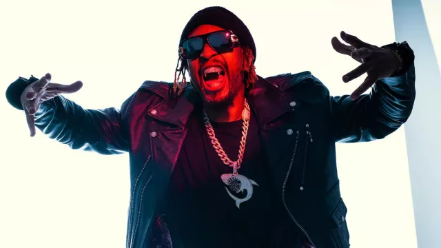 The black leather Perfecto jacket worn by Lil Jon in the YouTube video Photoshoot: Behind The Scenes!