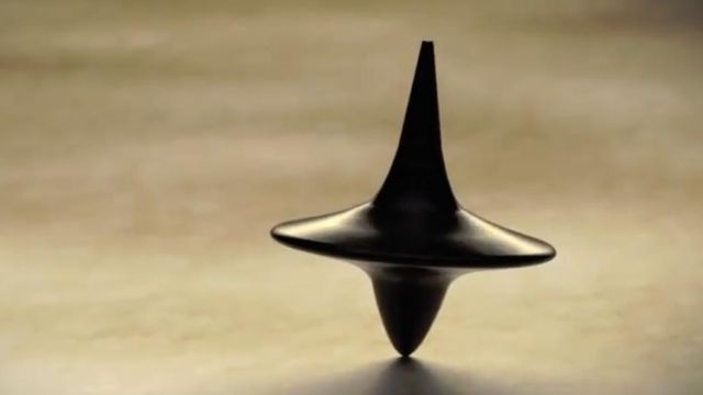 The spinning top totem of Dominic Cobb (Leonardo DiCaprio) in Inception