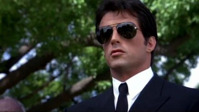 The pair of Ray-Ban Aviator sunglasses in black worn by Rocky Balboa (Sylvester Stallone) in the movie Rocky IV