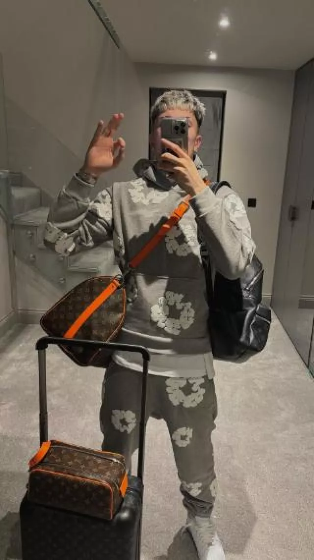 Louis Vuitton Black Monogram Horizon 55 Rolling Suitcase worn by Alejandro Garnacho on the Instagram account @garnacho7
